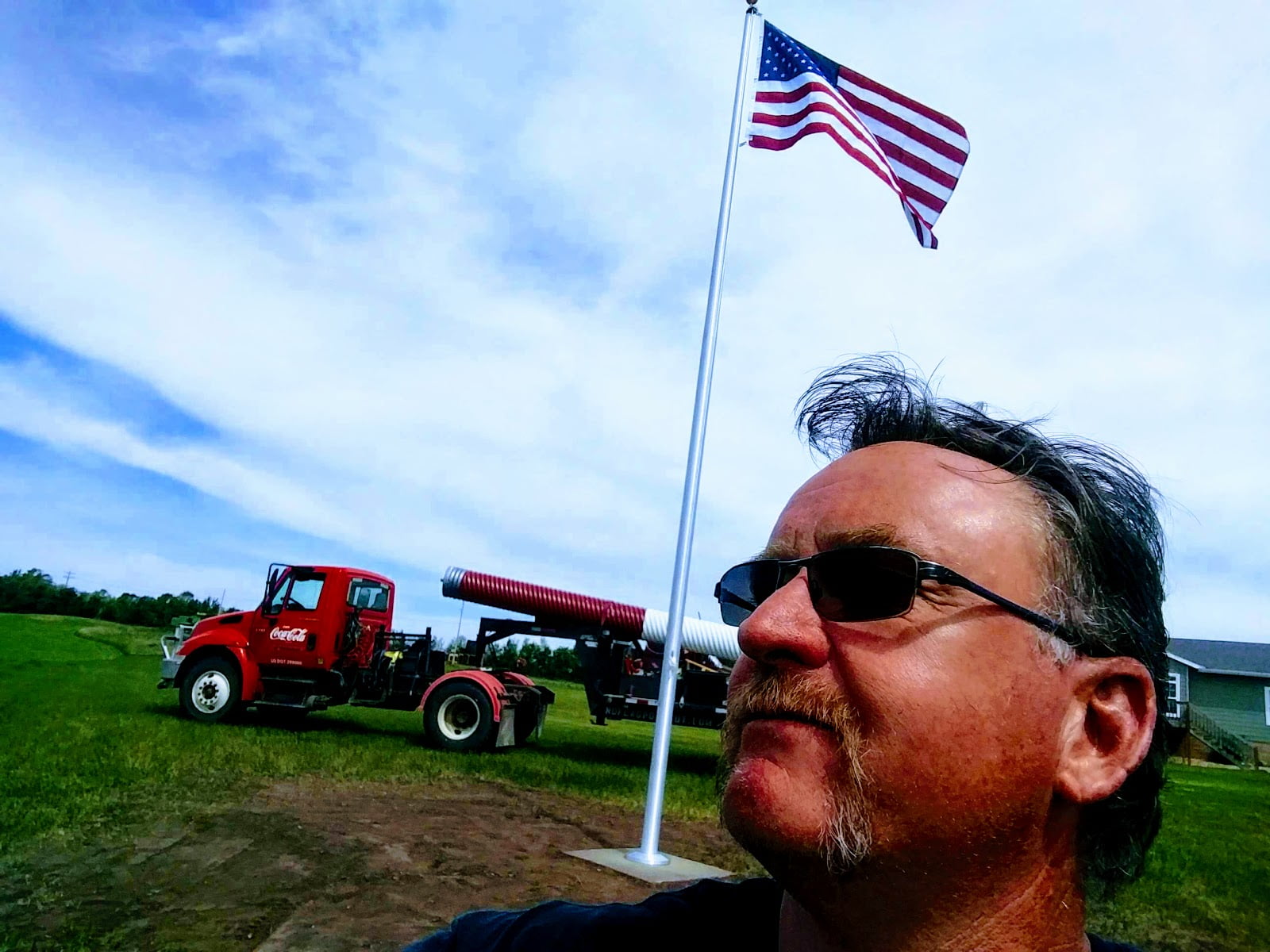 US Flagpole Guy Standing by Truck
