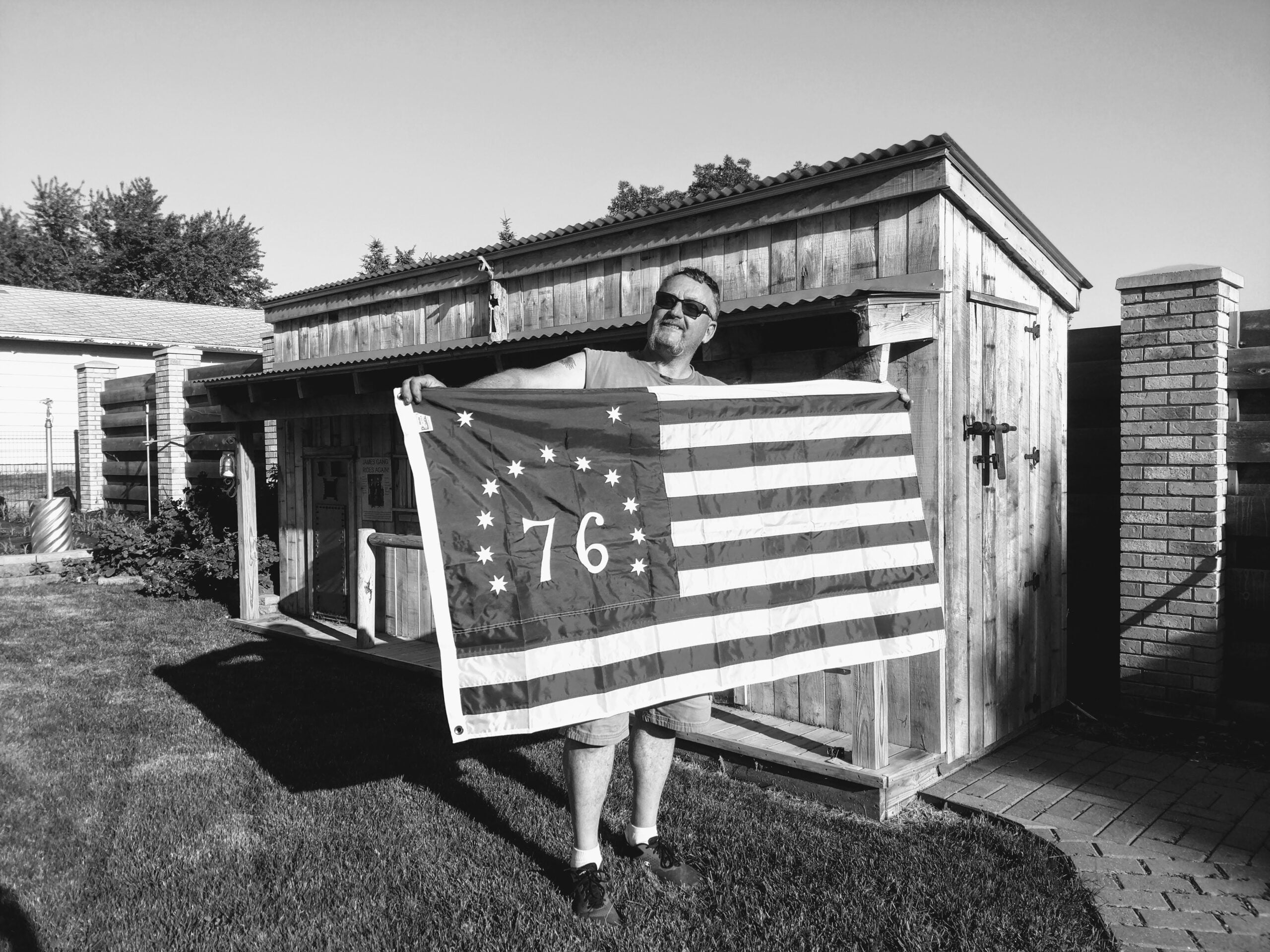 US Flagpole Guy Holding 1776 Flag